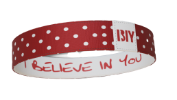 Red polka dot wristband with 'I BELIEVE IN YOU' text inside.