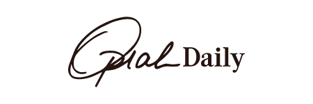 Logo with the text 'Oprah Daily' in cursive font.