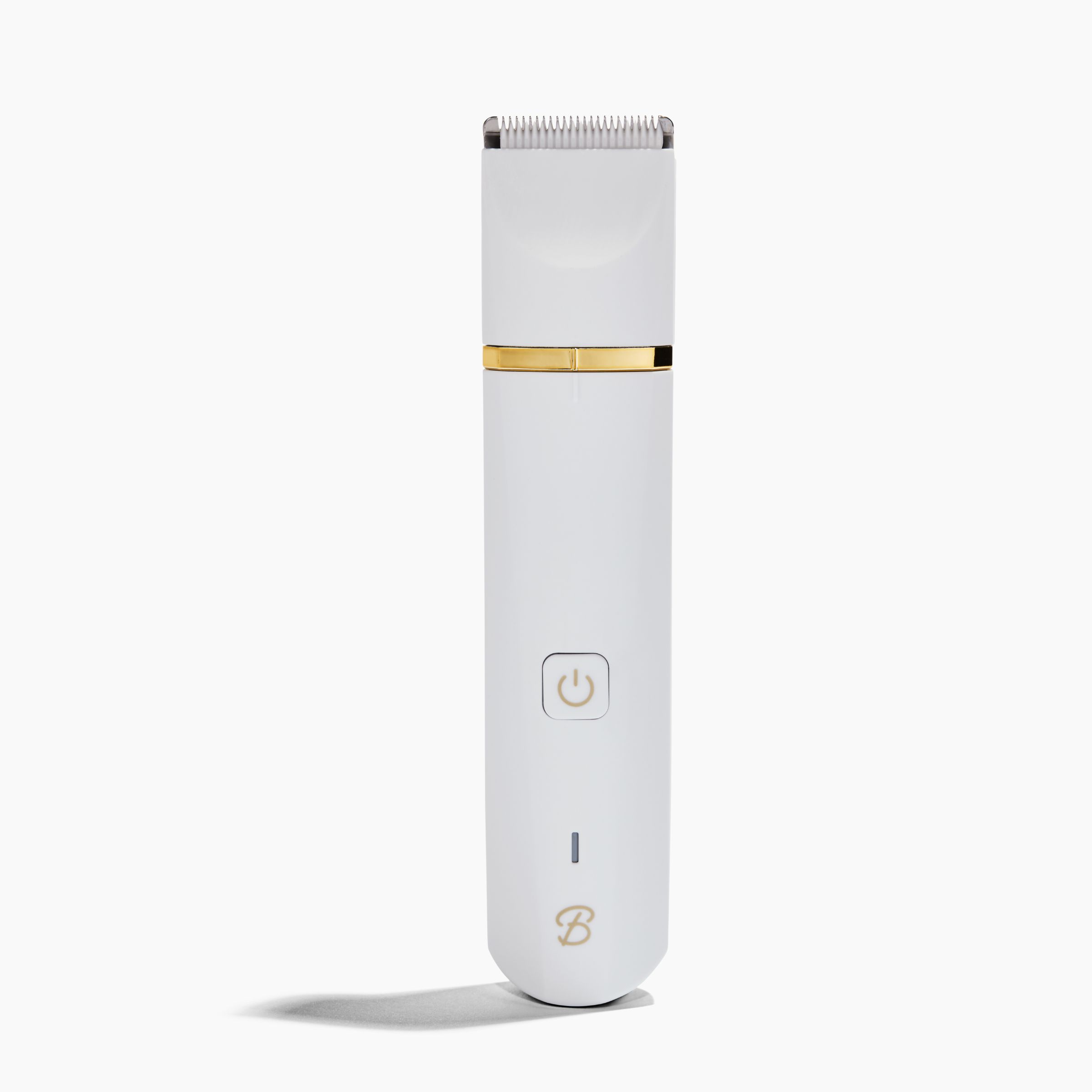 White electric hair trimmer with gold accents on a plain background.