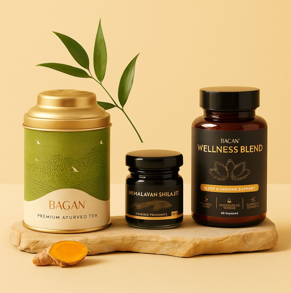 A tea tin, a jar of shilajit, and a bottle of wellness supplements sit on a stone.