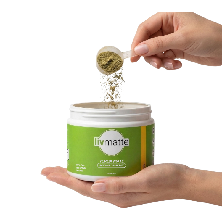 A hand pours a scoop of green Livmatte Yerba Mate instant drink mix into its white container.