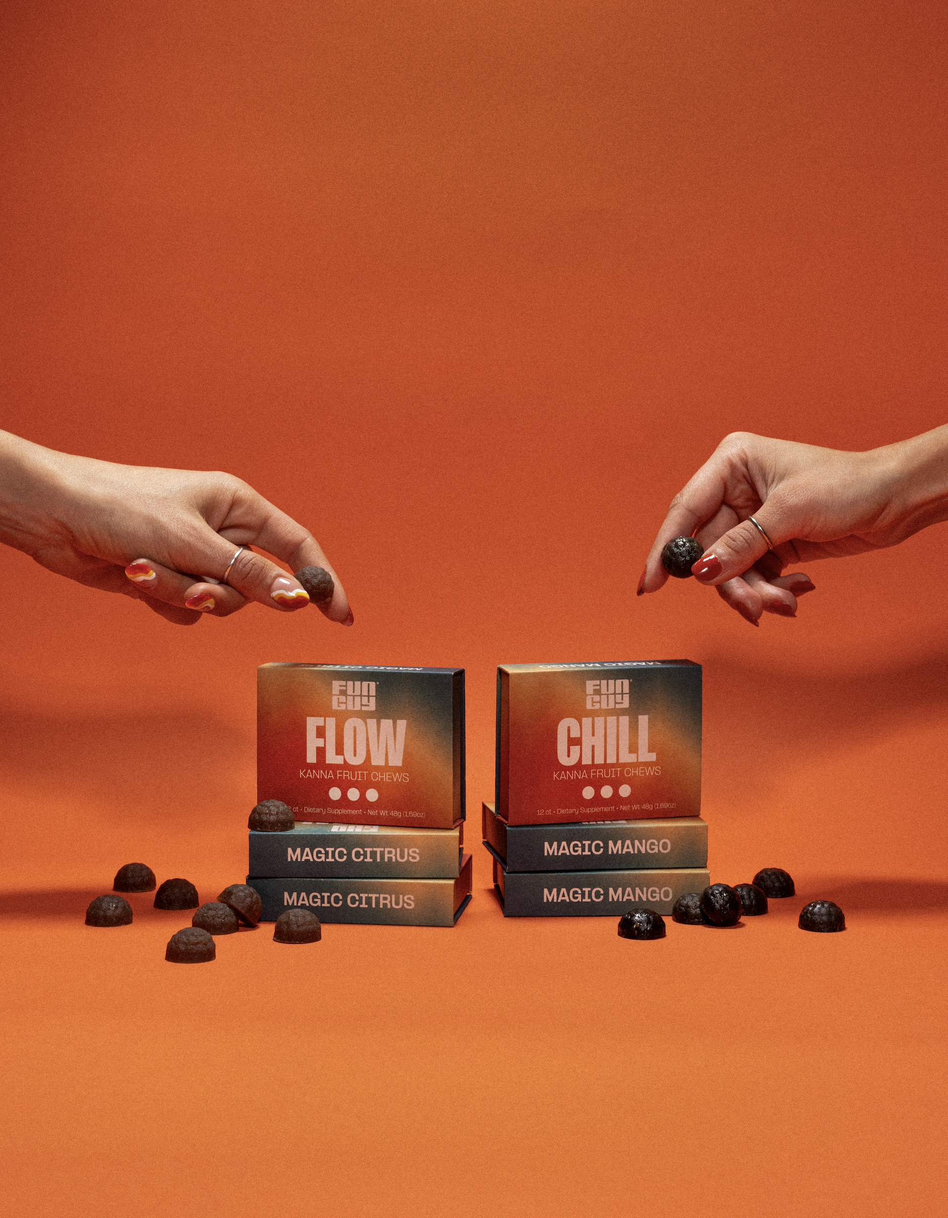 Two hands holding fruit chews above boxes labeled 'Flow' and 'Chill' on an orange background.