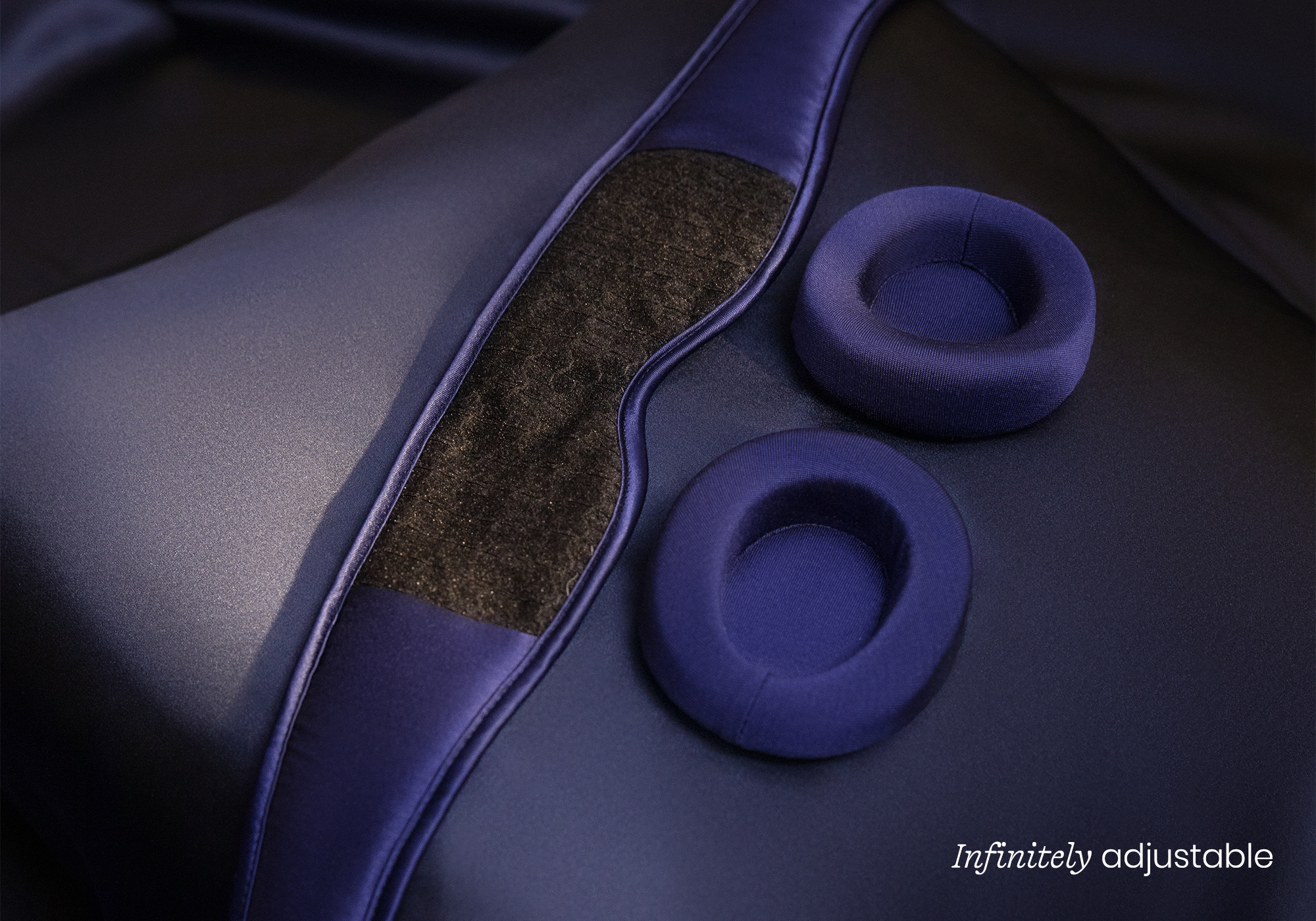 Oval speaker with turquoise top and control panel below.