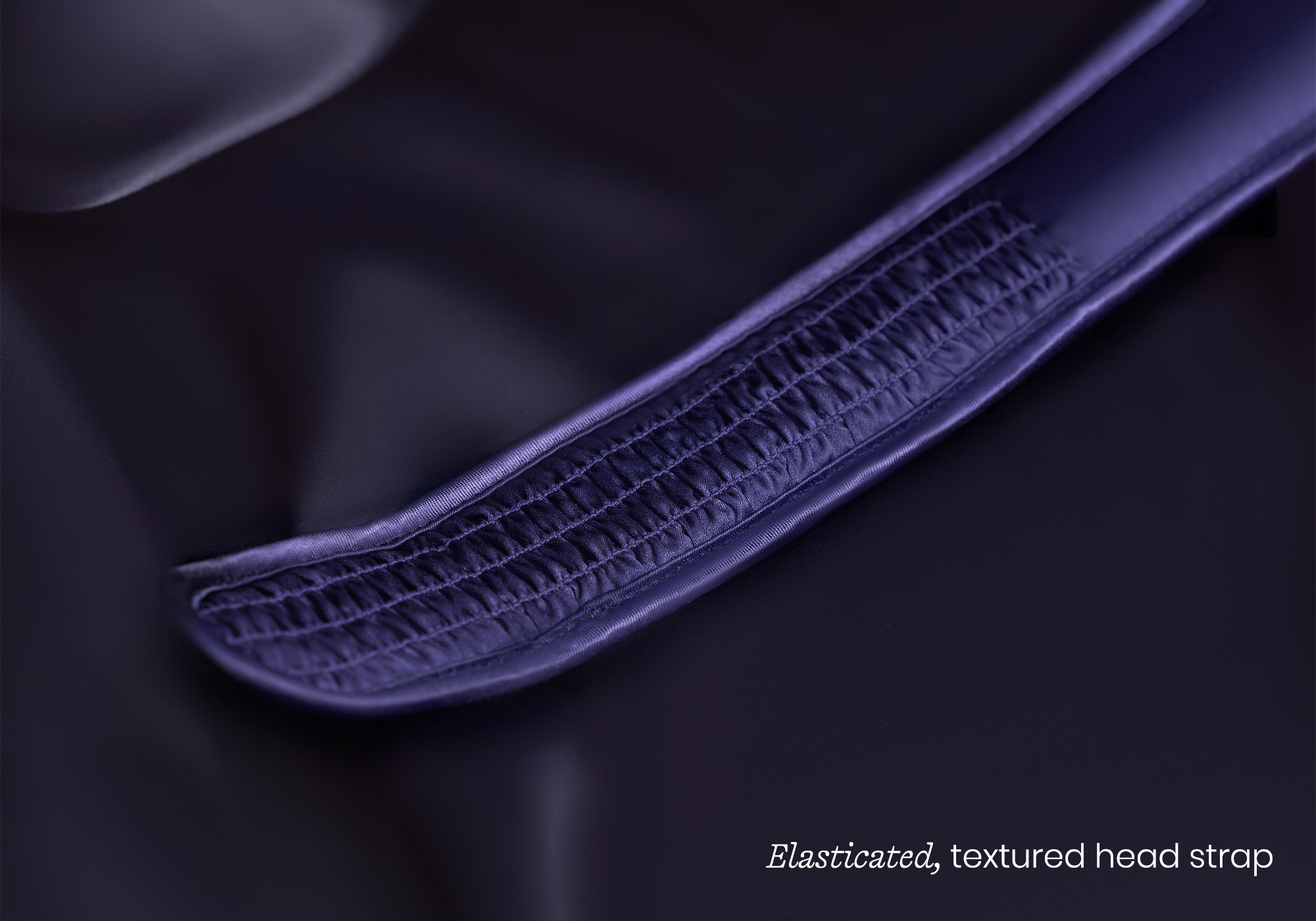 Oval speaker with turquoise top and control panel below.