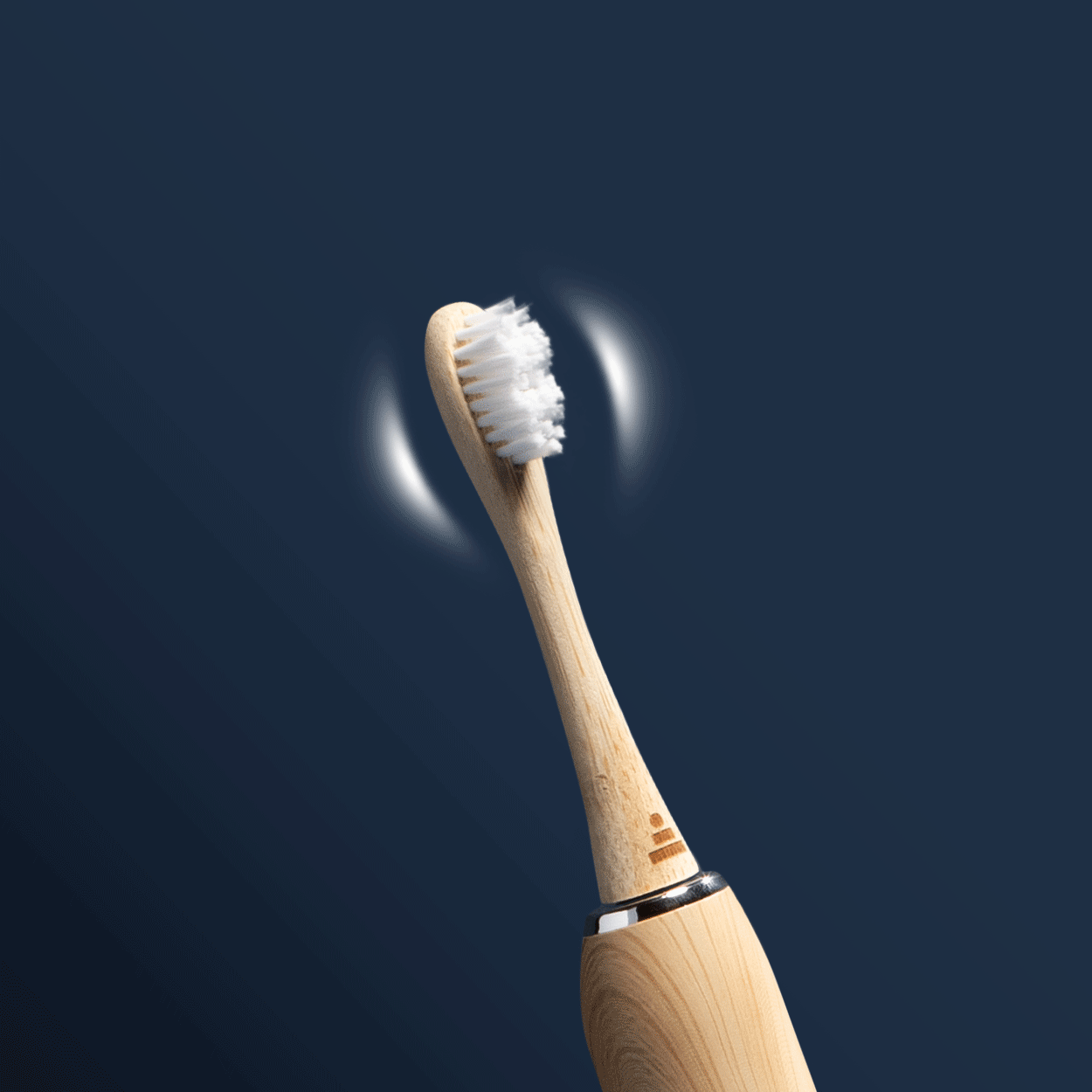 Wooden toothbrush head with bristles on a dark blue background.