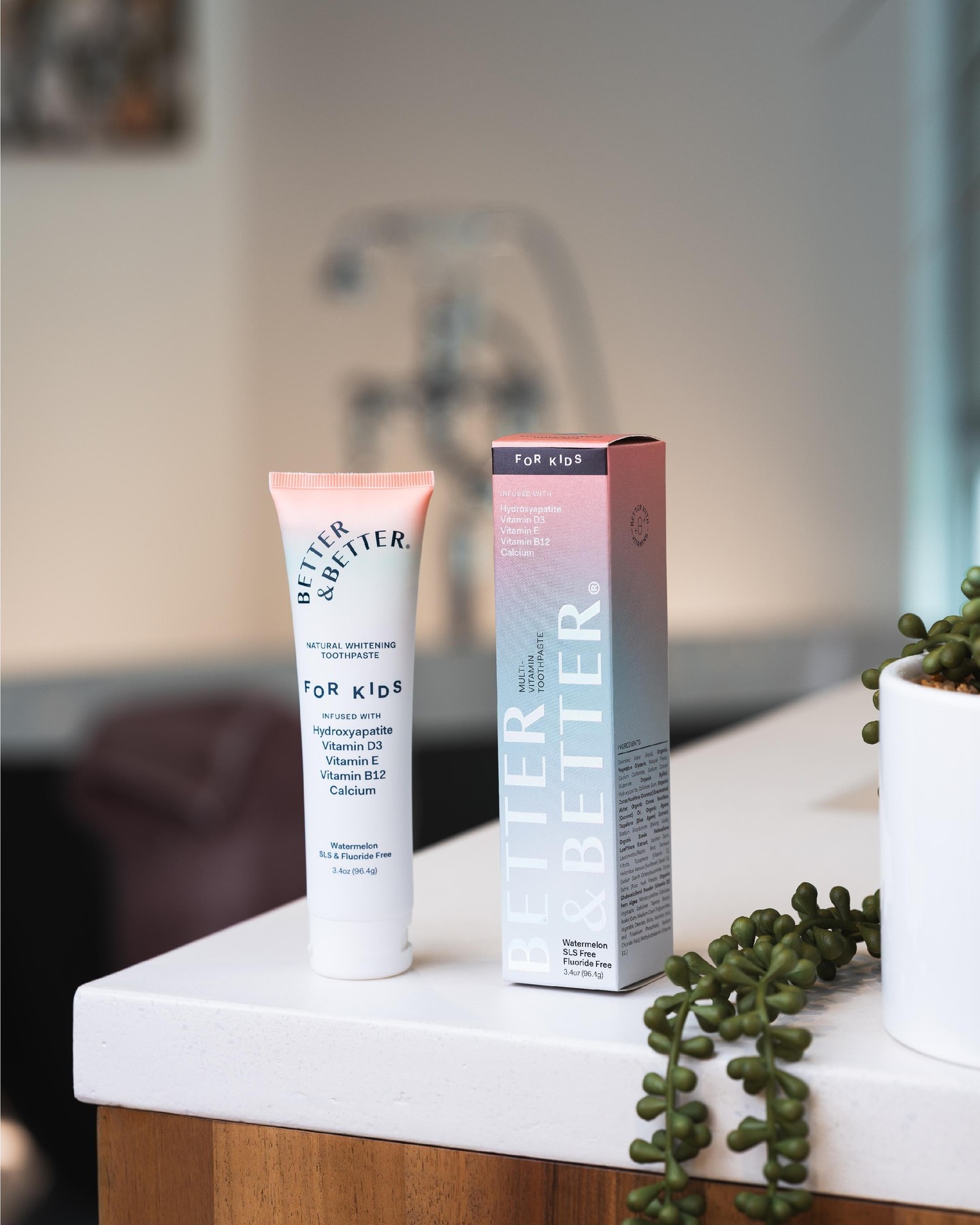 Toothpaste tube and box labeled 'Better & Better' on a countertop.