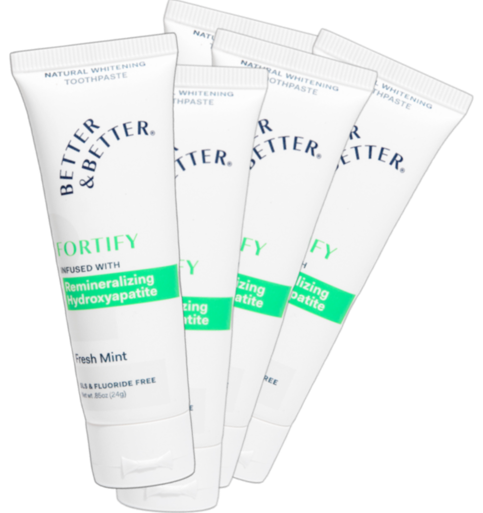 Four tubes of Better & Better toothpaste with green and white packaging.
