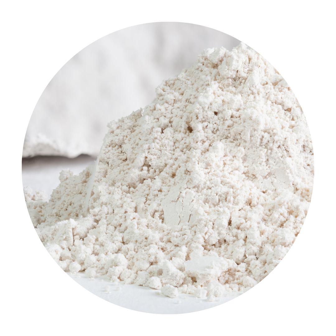 A pile of white powder on a white surface.