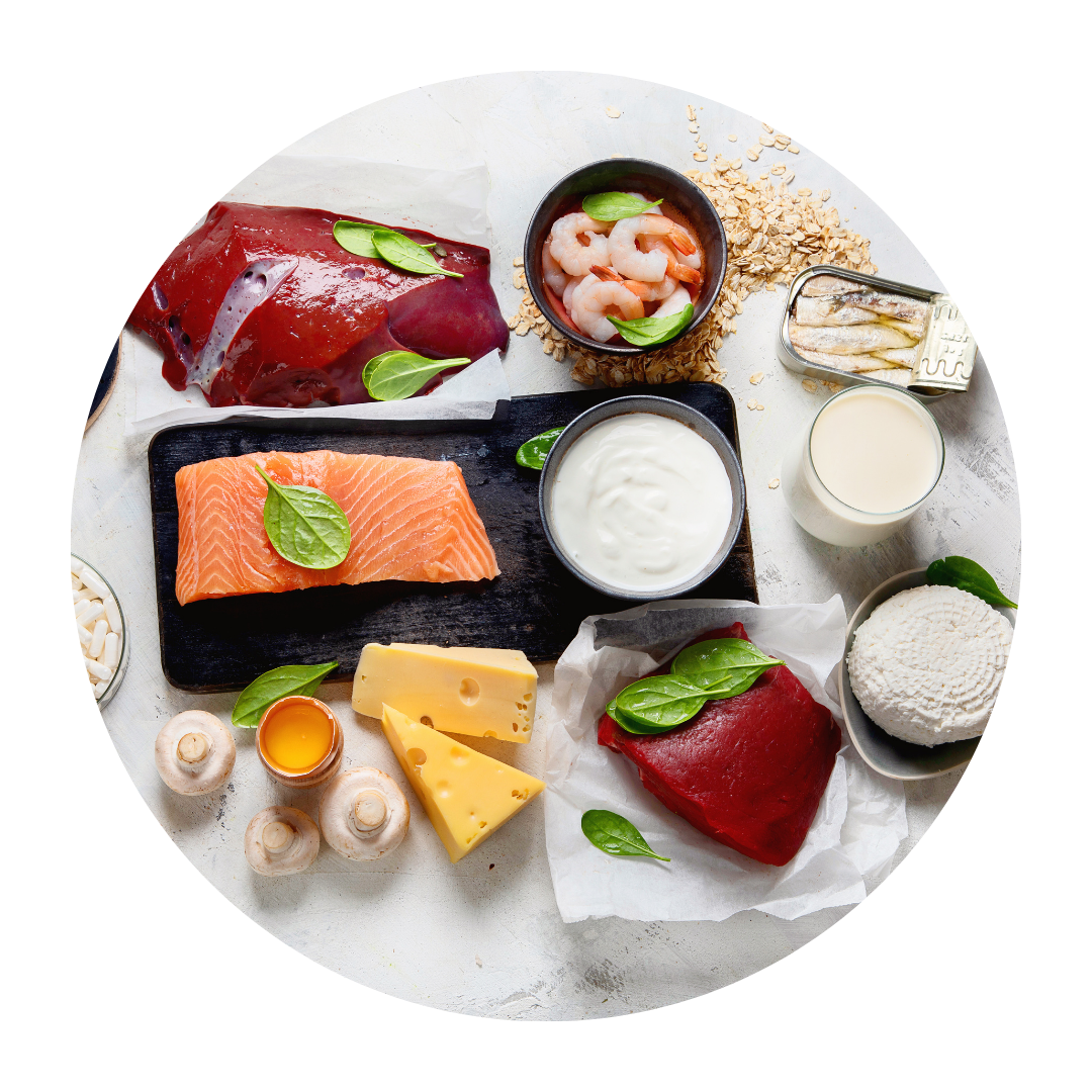 Assorted foods including salmon, cheese, shrimp, yogurt, and mushrooms on a white background.