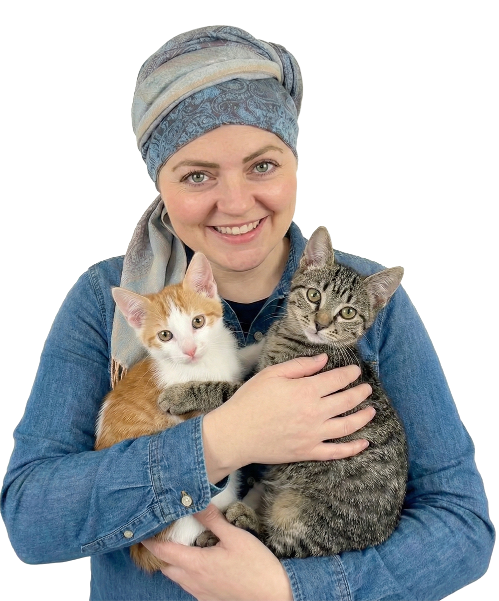 Person holding two cats, one orange-white and one gray tabby.