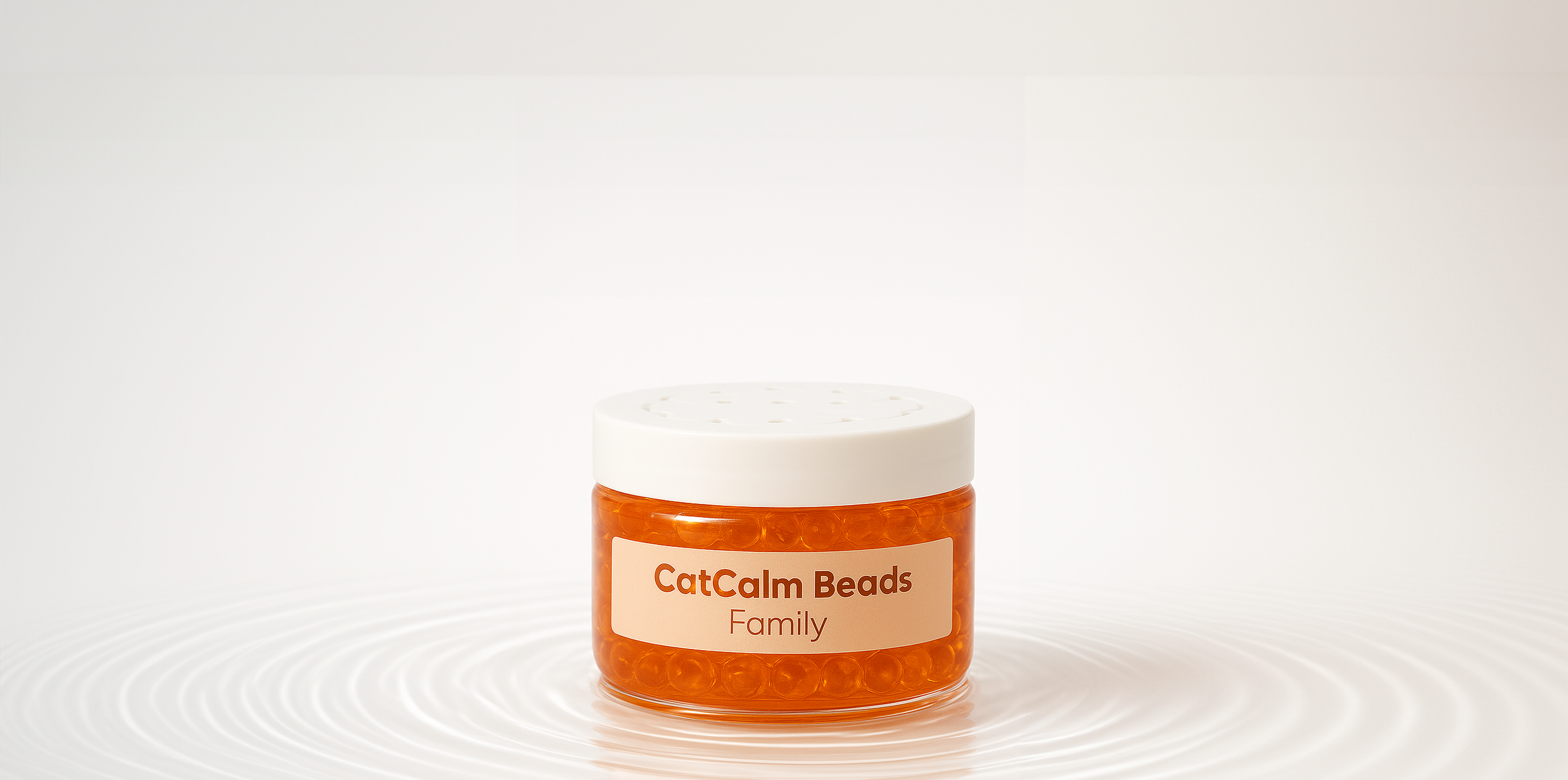 Jar of orange beads labeled 'CatCalm Beads Family' on a white surface.