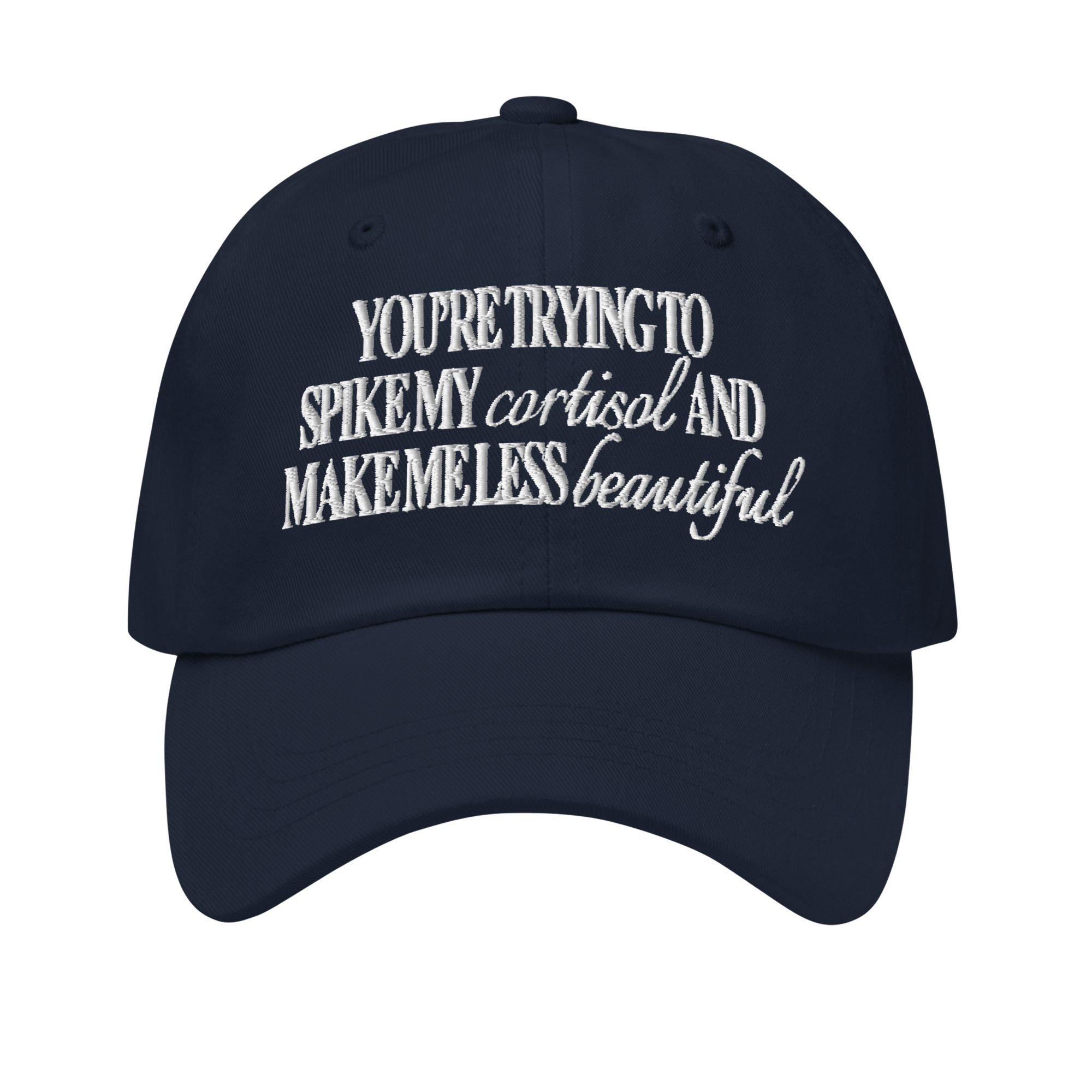 A navy blue baseball cap with the words 'You're trying to spike my cortisol and make me less beautiful' embroidered in white.