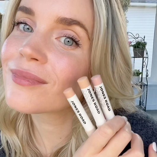 Person holding three makeup products labeled 'Jones Road.'