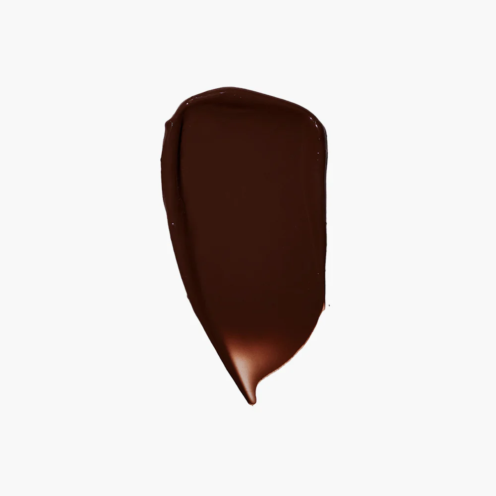 A smear of dark brown color on a white background.