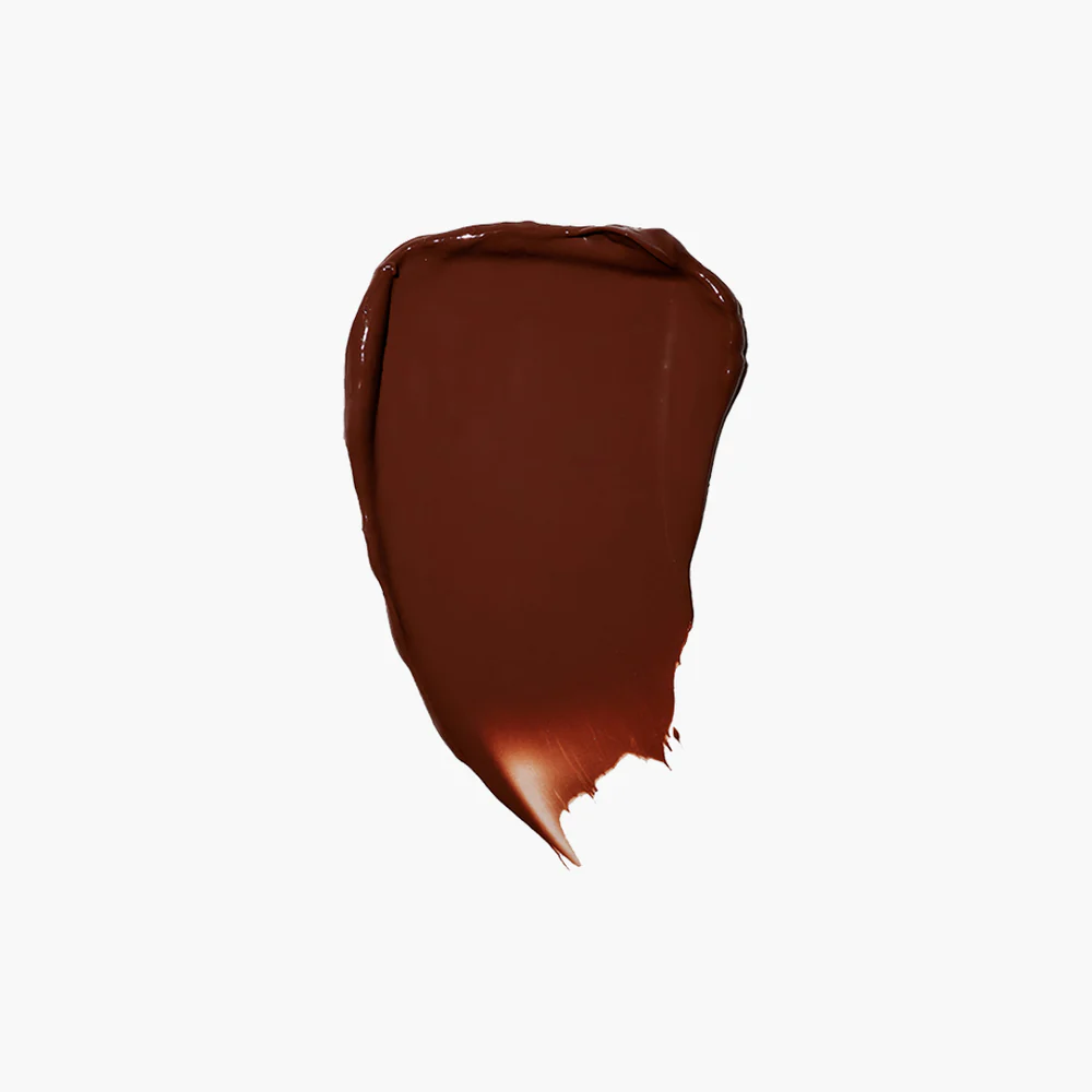 Brown paint smear on a white background.