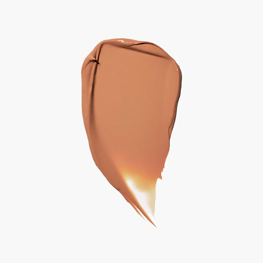 A smear of brown makeup on a white background.