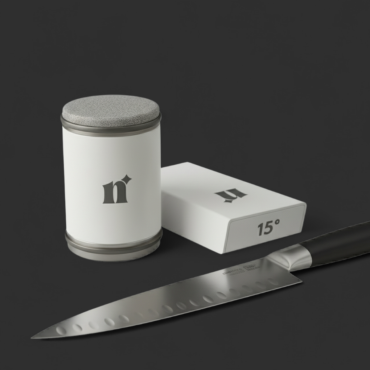 Knife, round container, and 15° block on a dark surface.