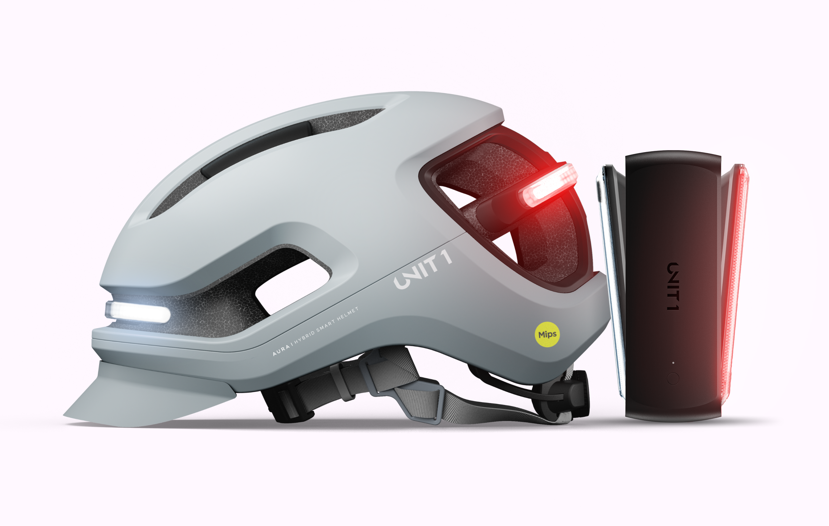 A light gray smart bicycle helmet with illuminated front and rear lights, next to a black accessory.