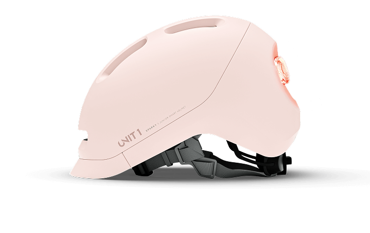 Side view of a pink bicycle helmet with a rear light.