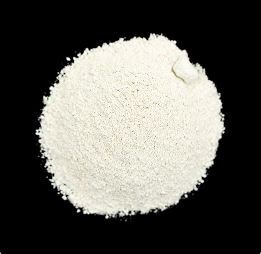 A mound of white powder on a black background.
