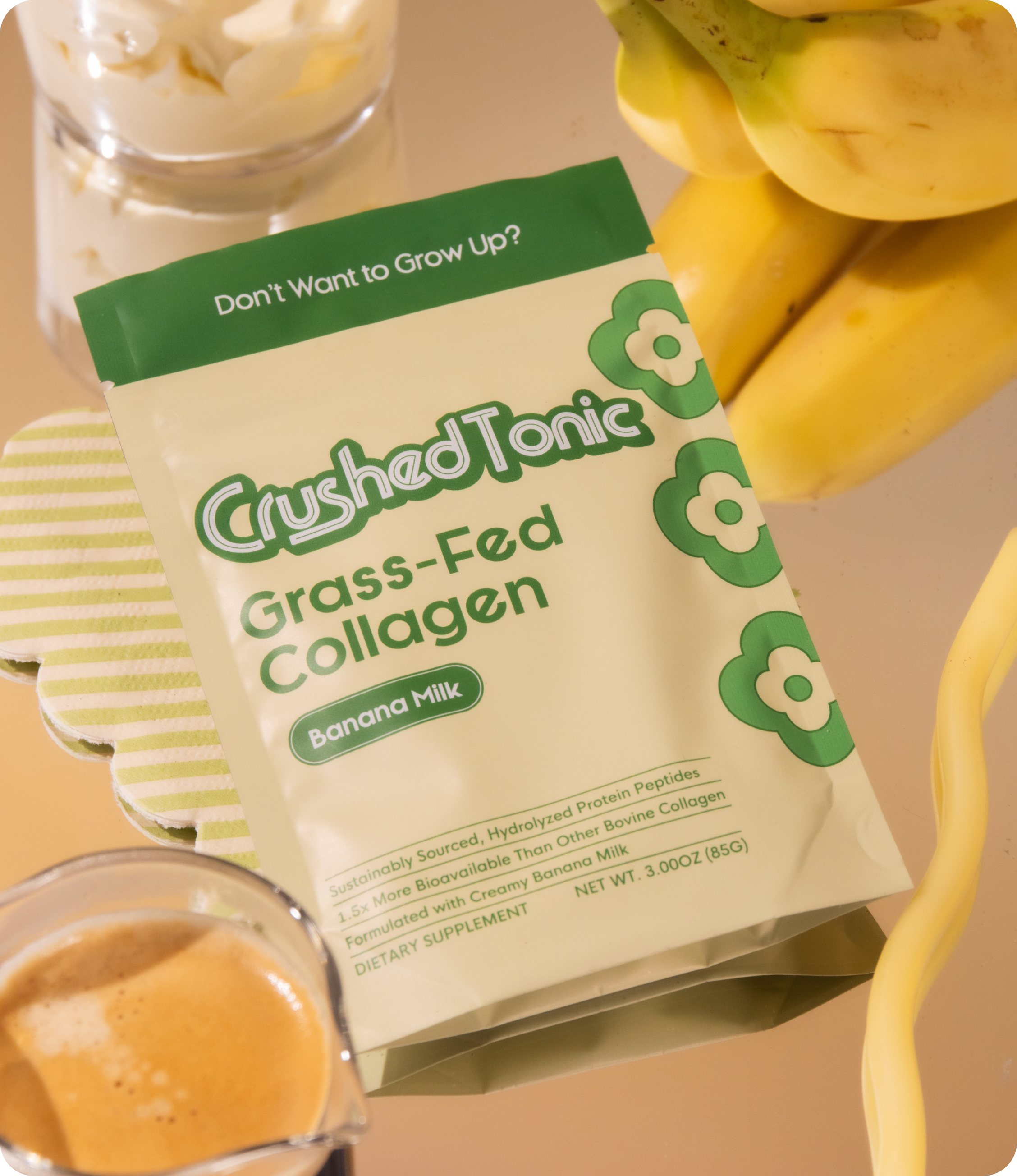 Package of CrushedTonic Grass-Fed Collagen with bananas and a glass of milk.