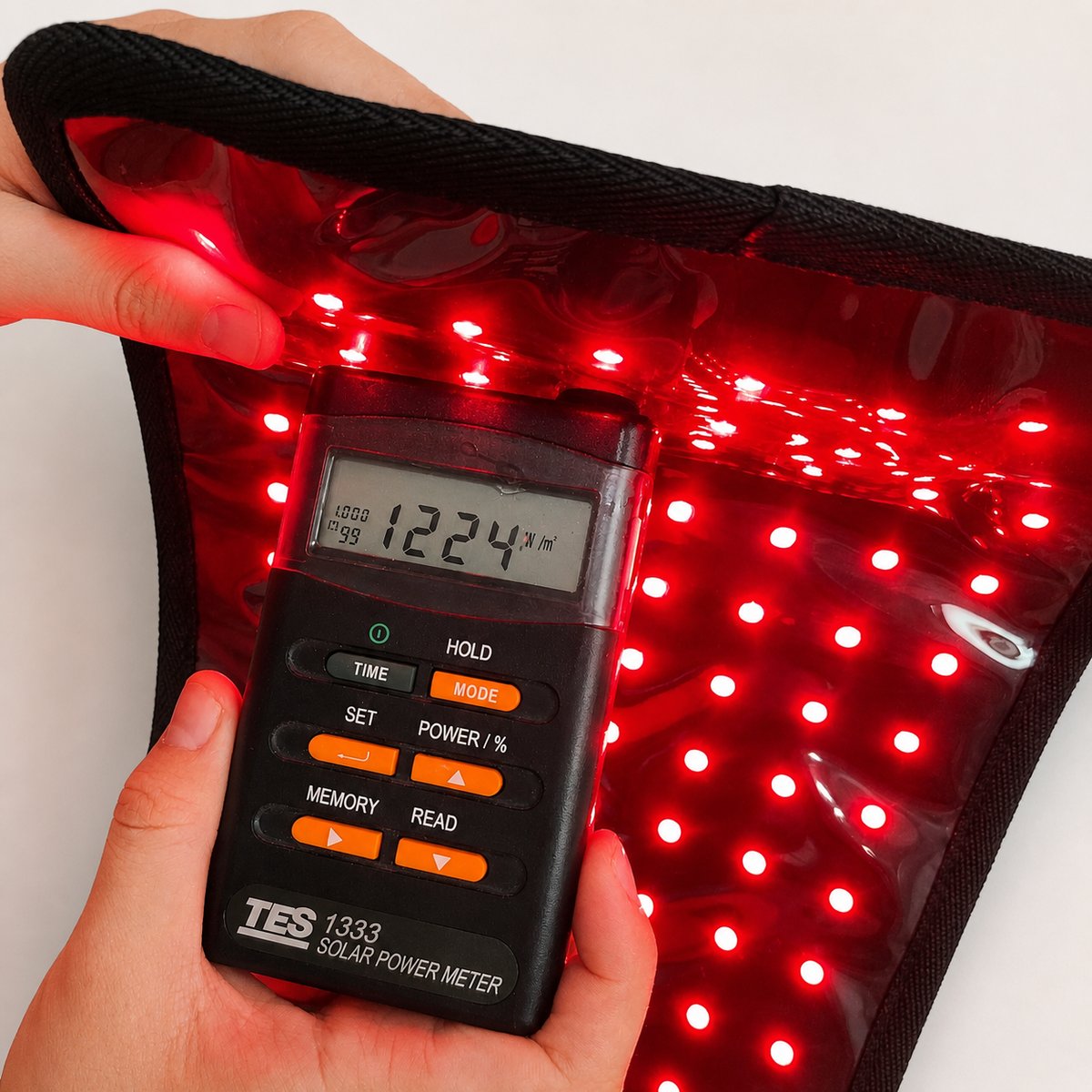 Solar power meter reading 122 mW/cm2 at the mat surface