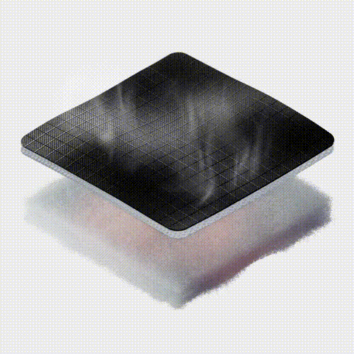 A black square with a grid pattern and smoke rising from it.