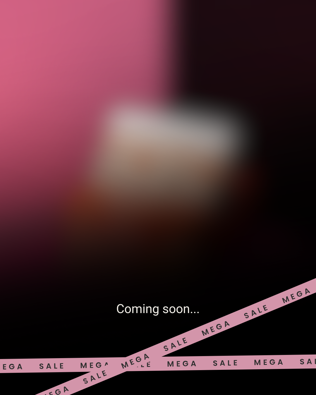 Blurry image with 'Coming soon...' text and 'MEGA SALE' tape overlay.