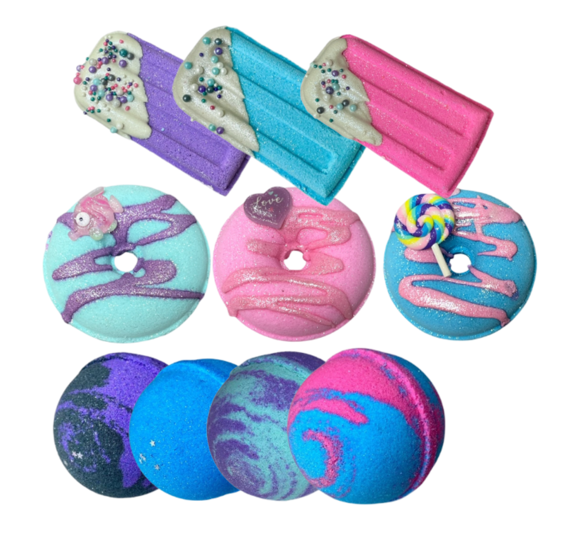 Colorful bath bombs shaped like popsicles, donuts, and spheres with decorative toppings.
