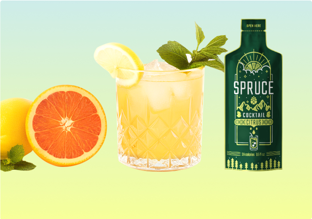 Citrus cocktail with lemon, grapefruit, and a green Spruce cocktail package.