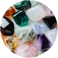 Various colorful gemstones arranged in close-up.