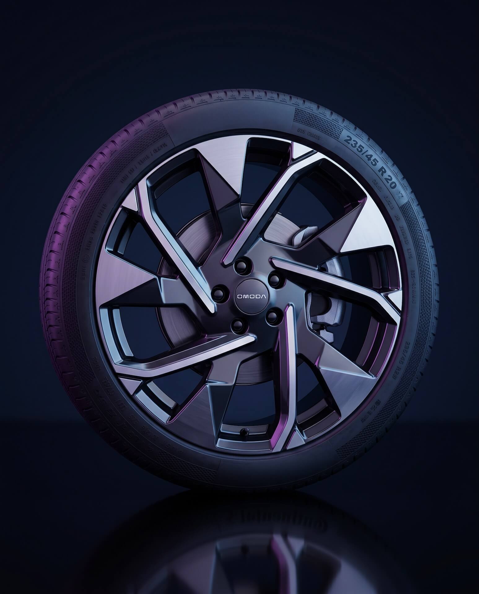 A close-up of an Omoda car wheel with a Continental tire against a dark, reflective background.