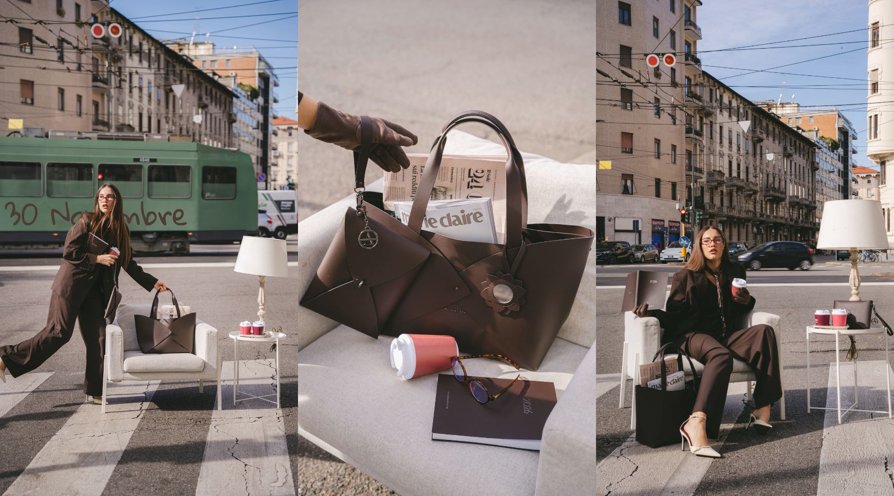 Woman in a suit sitting on an armchair in the street with coffee and a bag.