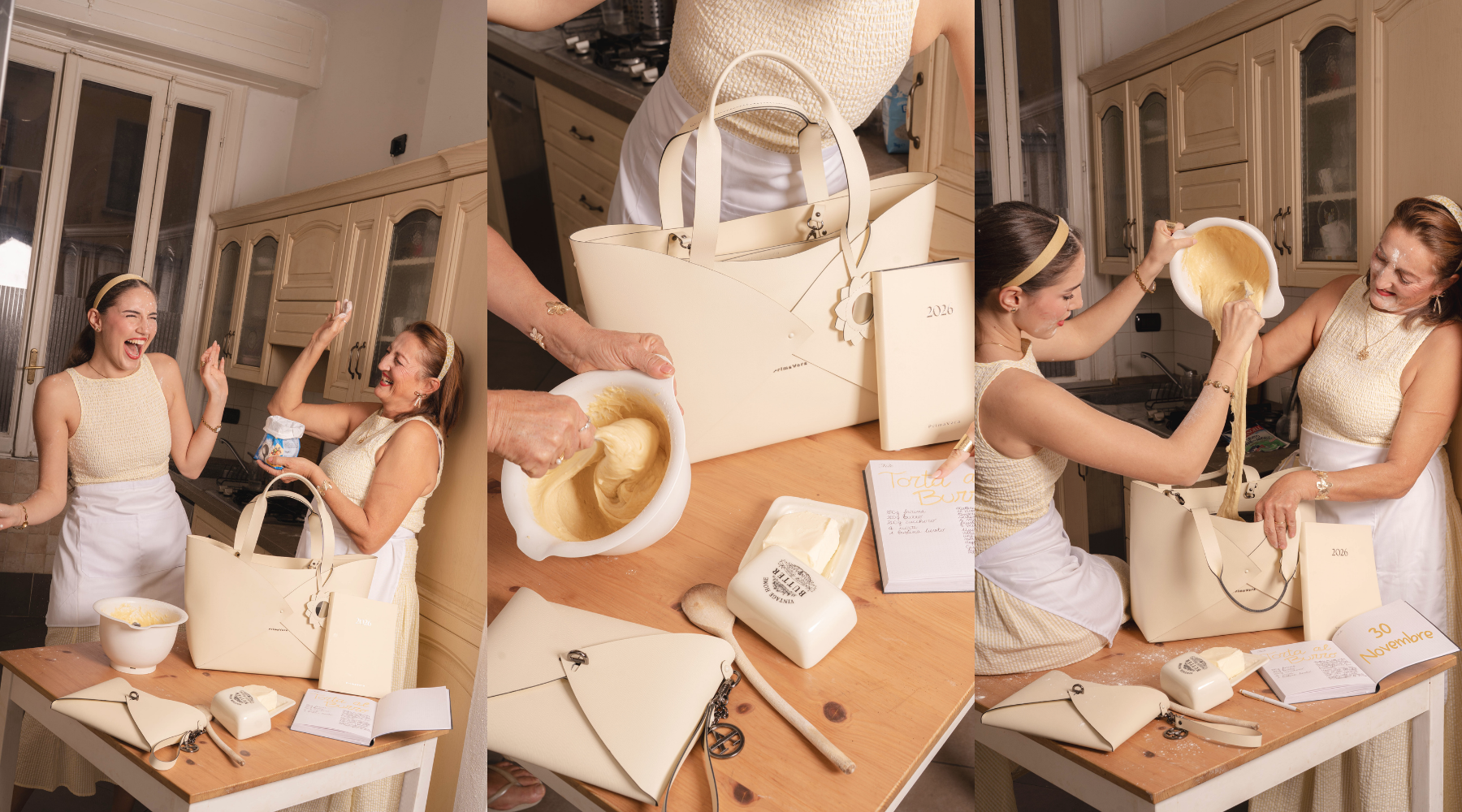 Two women joyfully baking in a kitchen with a large handbag on the table.