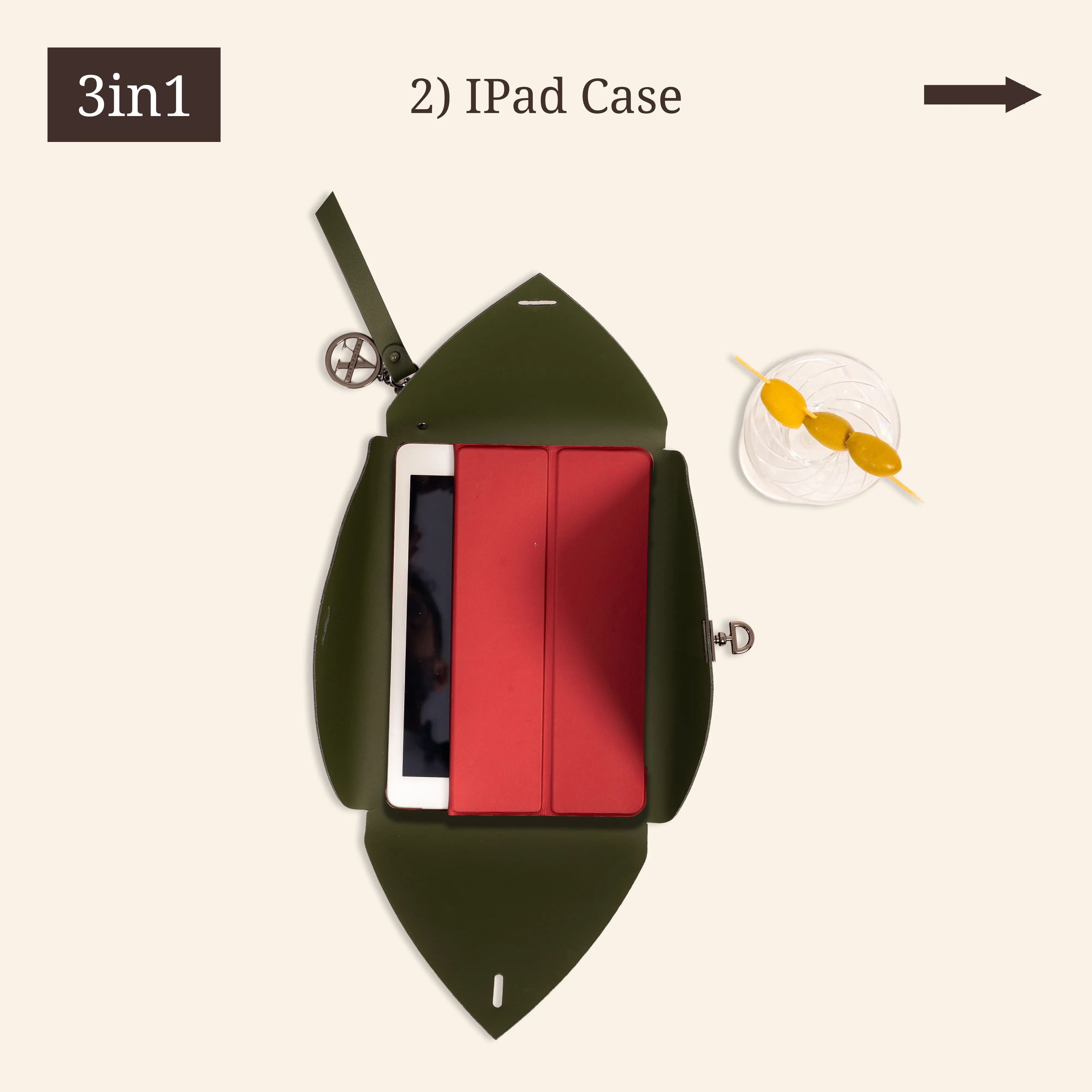 Green iPad case with a red cover, next to a drink with three olives.