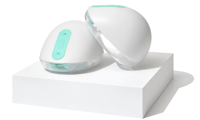 Two white and teal electronic devices on a white block.