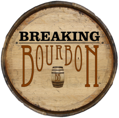 A wooden barrel top with the text 'Breaking Bourbon' and a small barrel illustration.