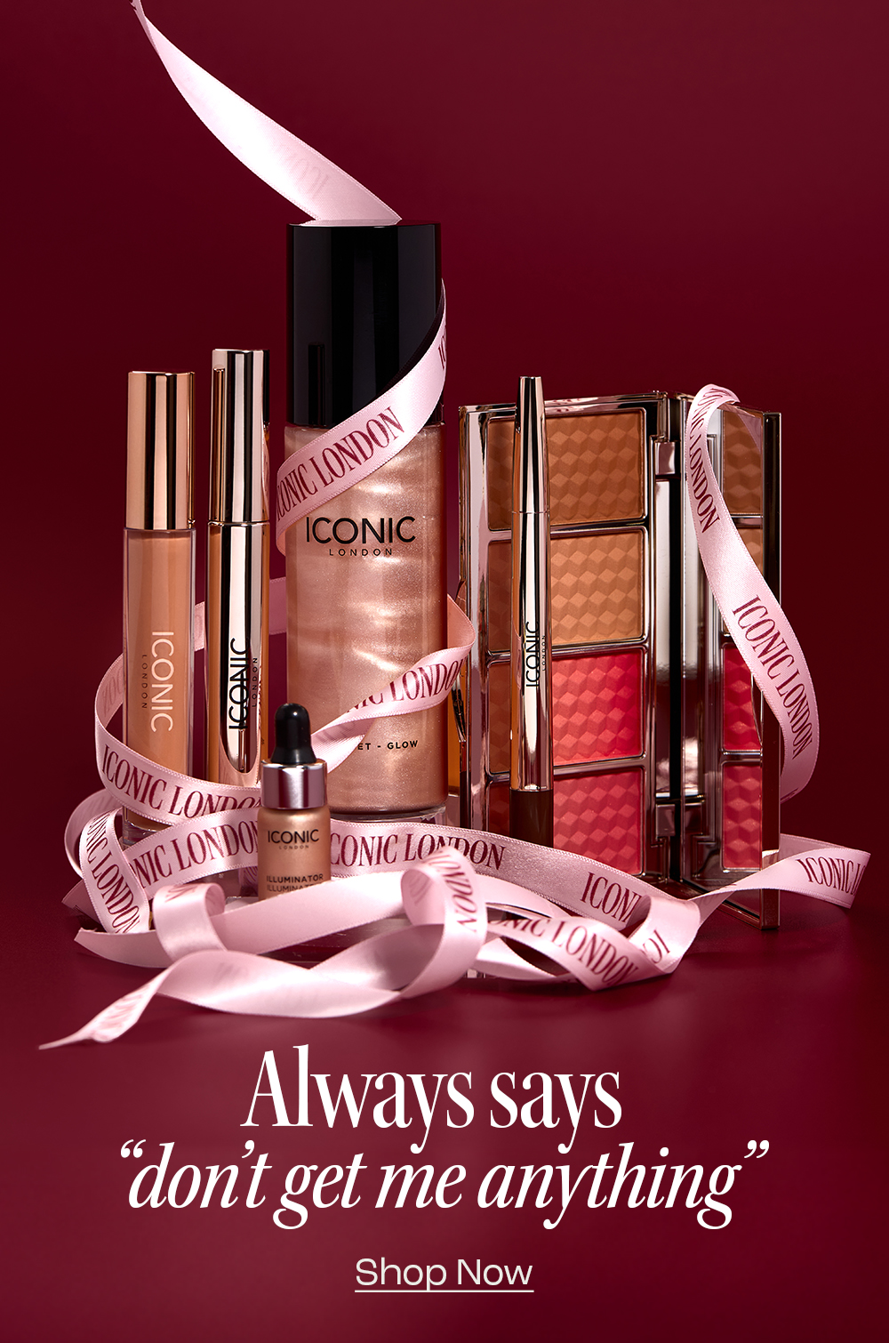 Assorted Iconic London makeup products with a ribbon and text overlay on a red background.