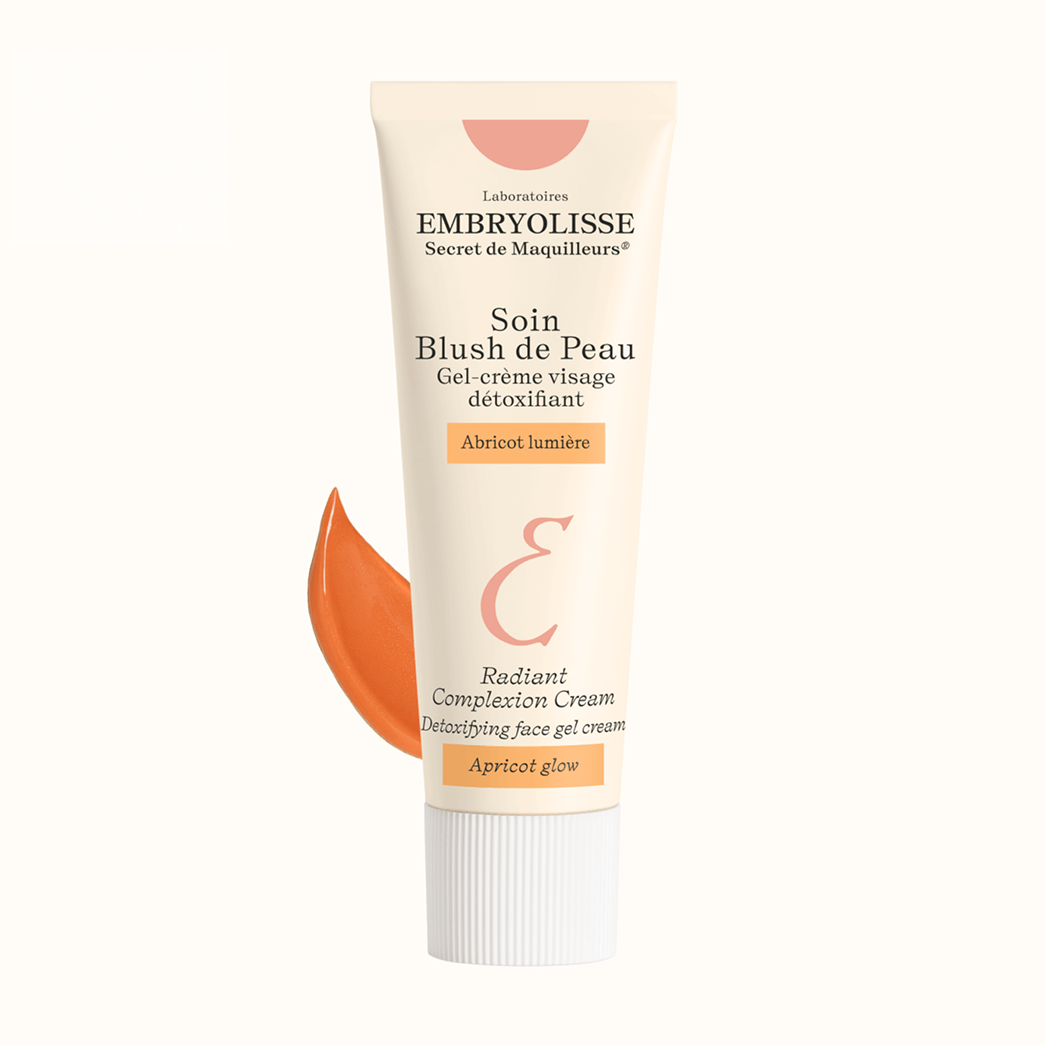 Tube of blush cream with apricot shade displayed.