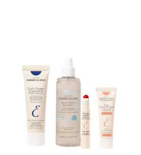 Four skincare products in tubes and a spray bottle.