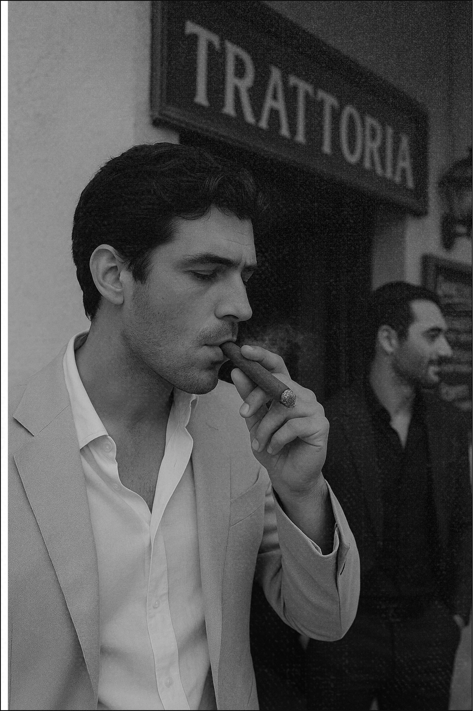 Man in a suit smoking a cigar outside a trattoria.