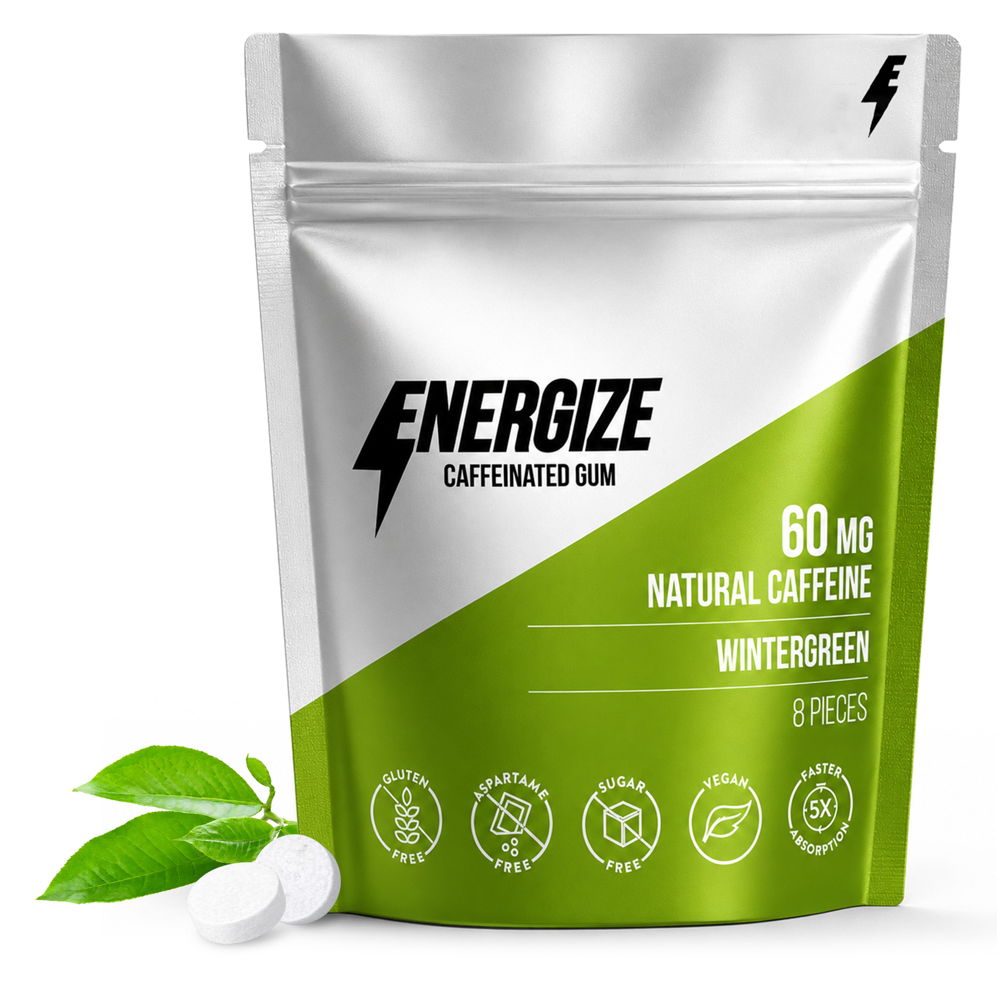 A silver and green pouch of Energize Caffeinated Gum with two pieces of gum and leaves nearby.