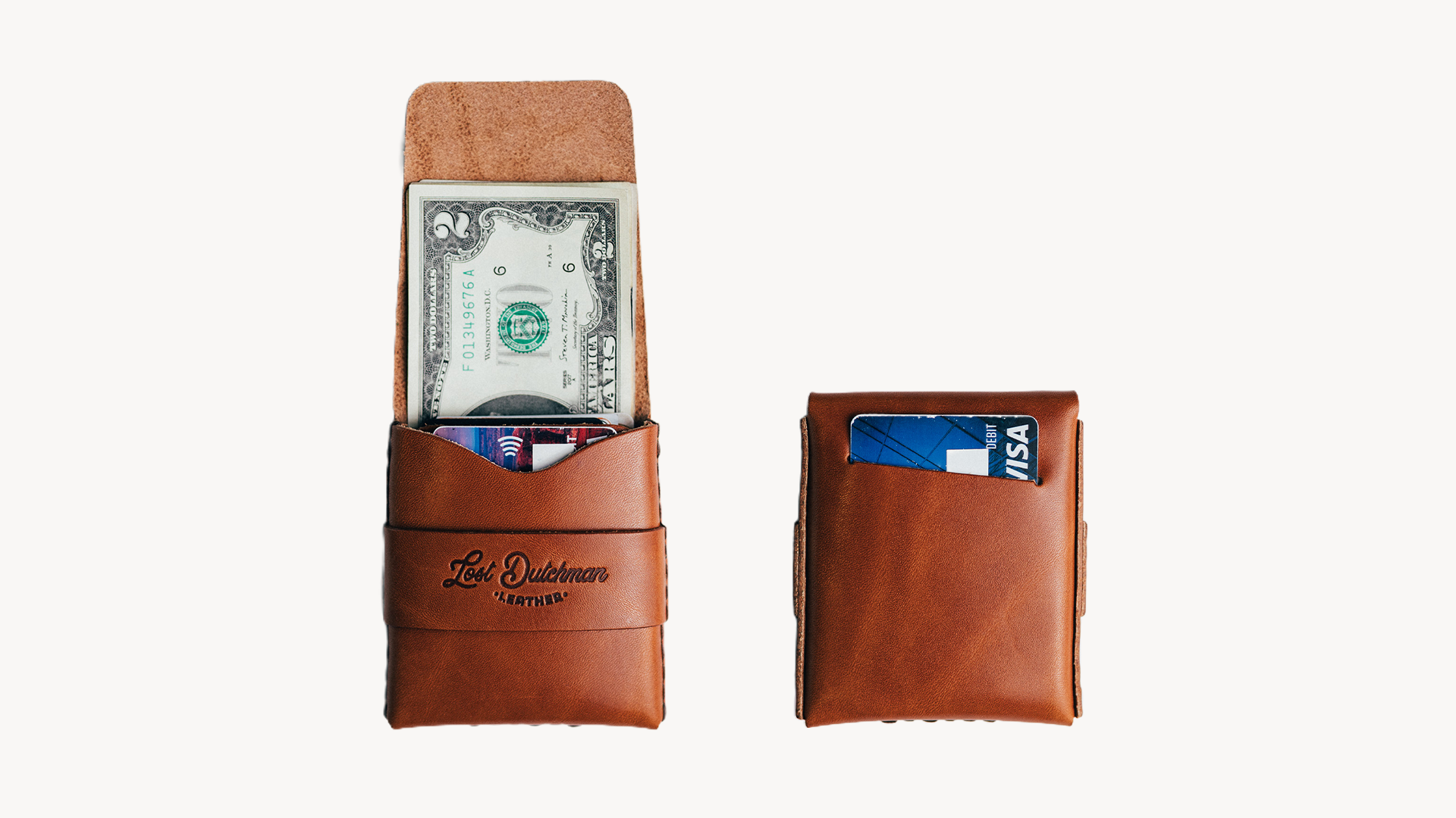 Two brown leather wallets, one open with cash and cards, and one closed, on a white background.