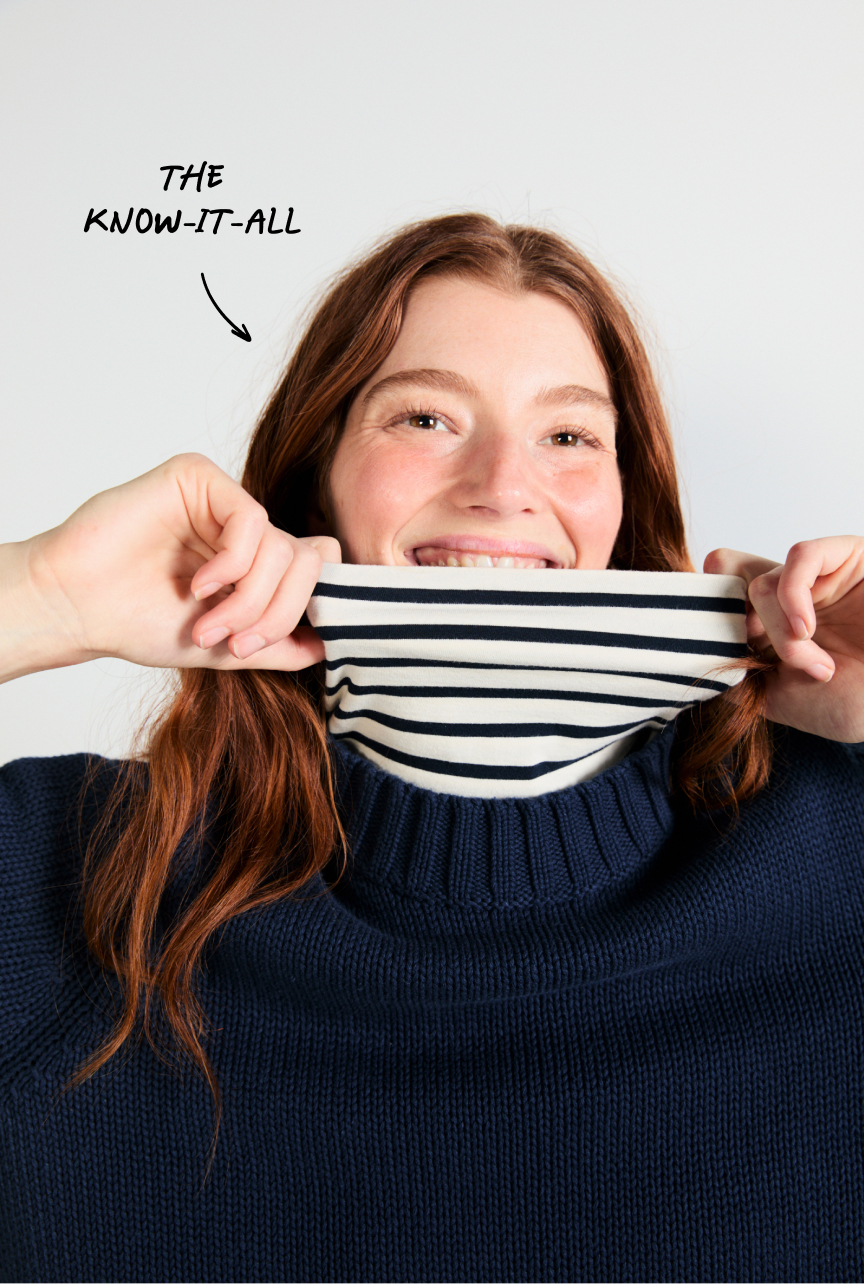 The know-it-all, wearing the Turtleneck in Cream Navy