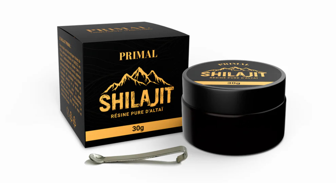 Black box and jar labeled 'Primal Shilajit' with a small metal spoon.