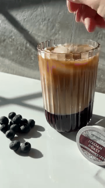 Illustration of a green cup with sparkles around it.