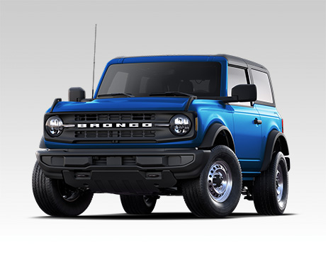 A front three-quarter view of a blue two-door Ford Bronco against a plain light gray background.