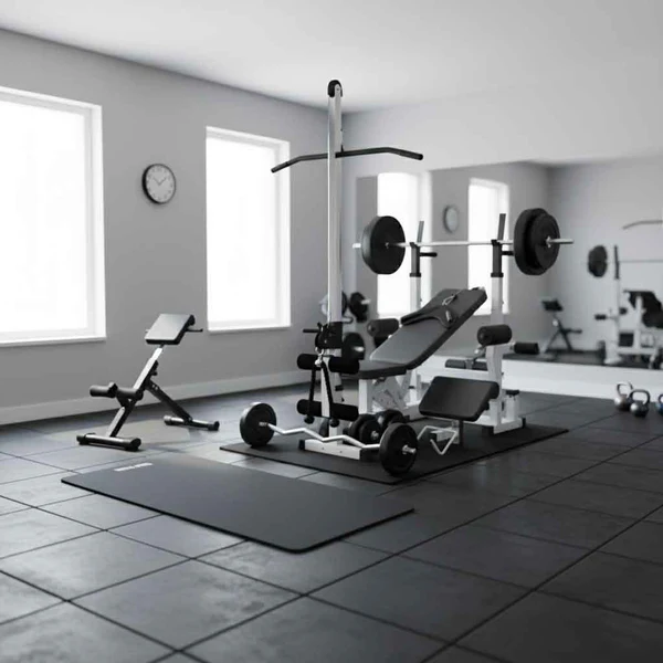 Home gym with weight bench, barbell, and exercise mat.