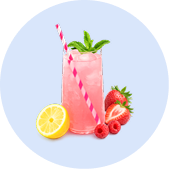 A glass of pink lemonade with a straw, garnished with mint, surrounded by fresh lemon and berries.