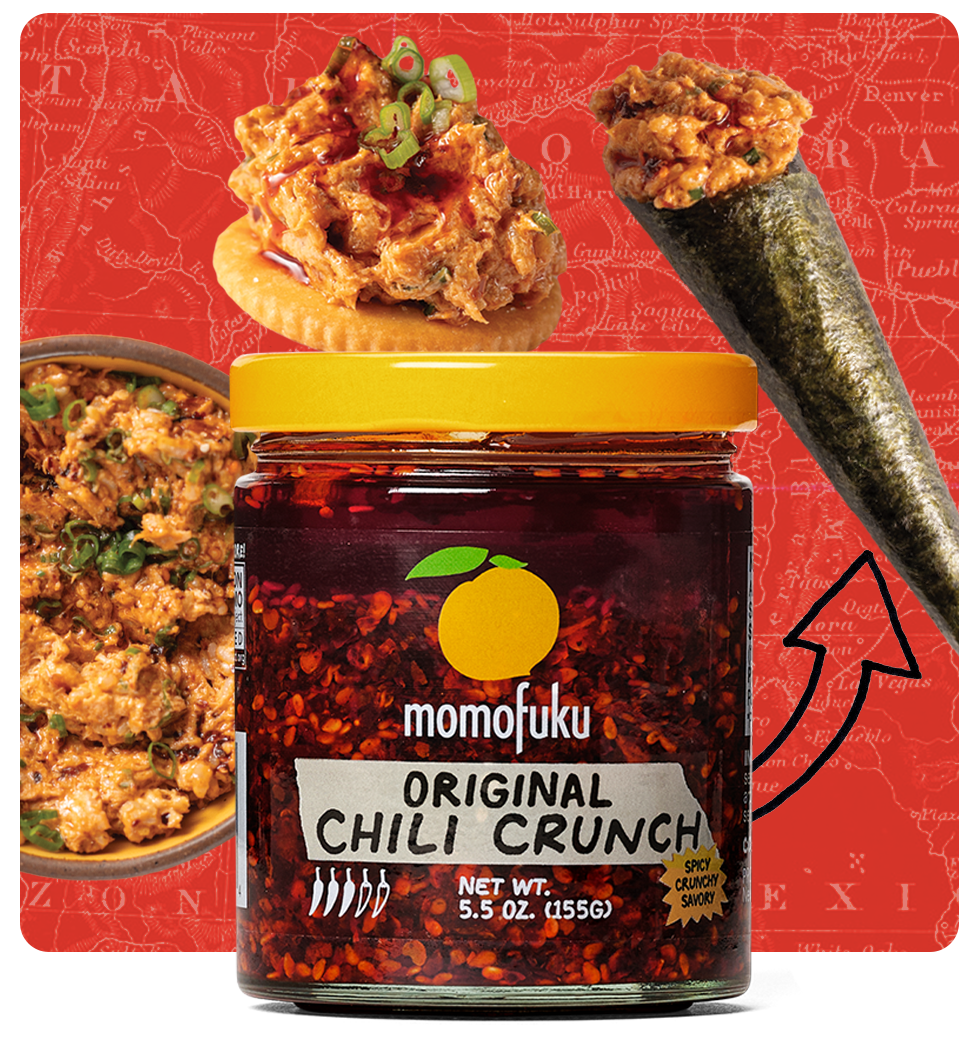 A jar of Momofuku Chili Crunch surrounded by food pairings like a hand roll and a cracker with dip.
